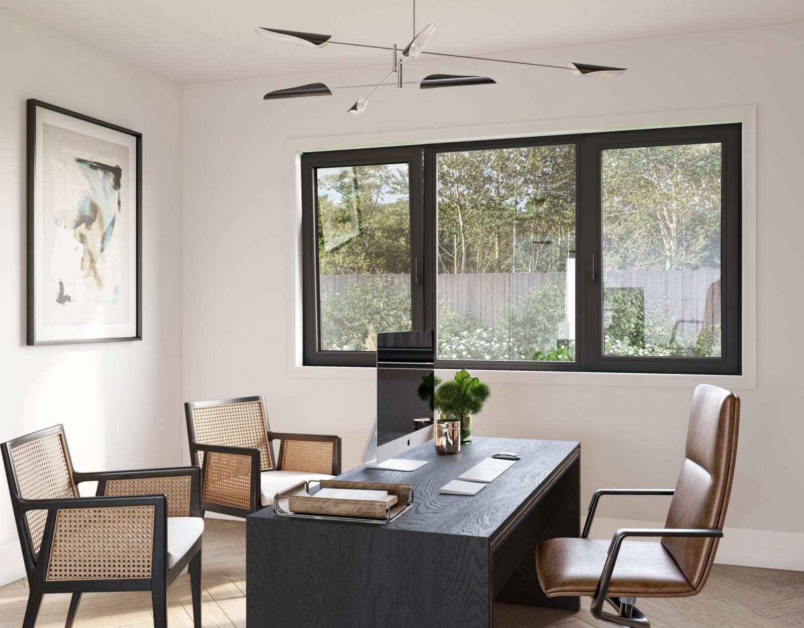 Home office with a large three-section black tilt-and-turn window