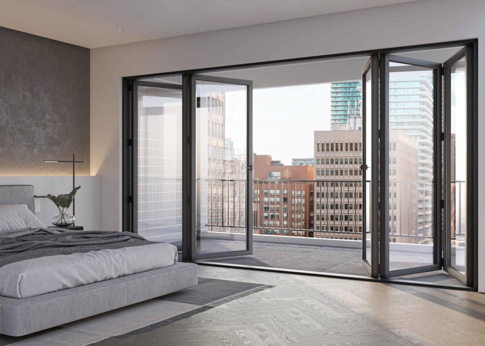 Bedroom with bifold accordion doors open onto a balcony with a city view