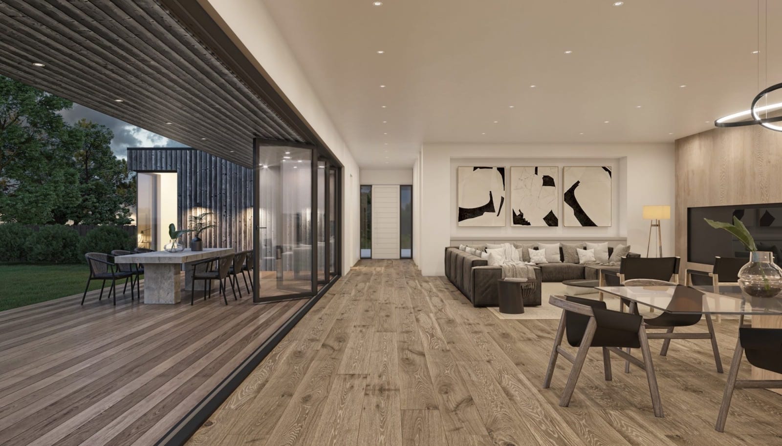 Interior view of a large living space with bifold accordion doors open onto the deck