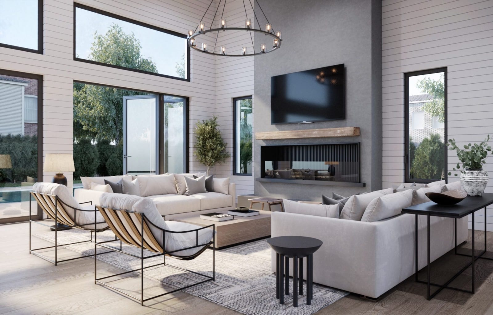 Living room with a cathedral ceiling, black bifold accordion doors and a fireplace
