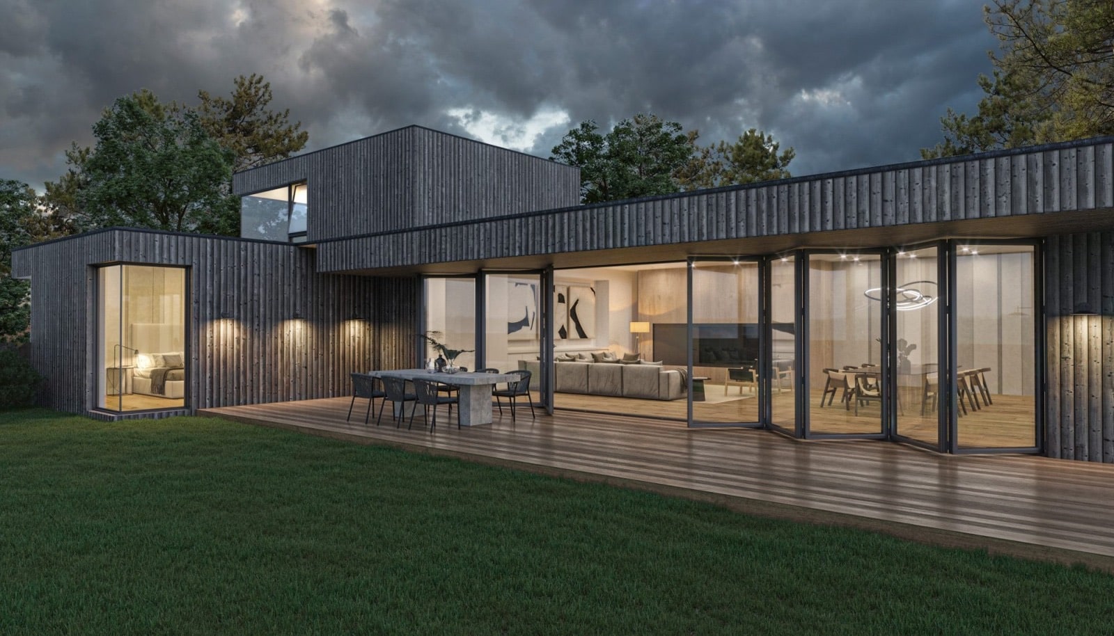 Contemporary house at dusk with bifold accordion doors open onto a wood deck