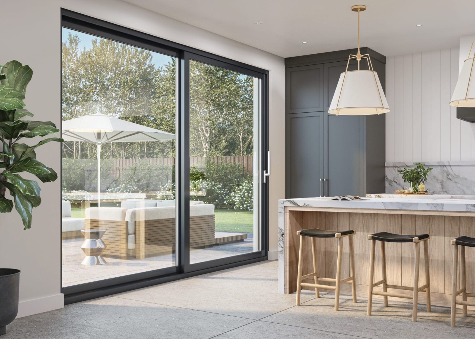 Kitchen with a black lift-and-slide door opening onto a patio with an umbrella