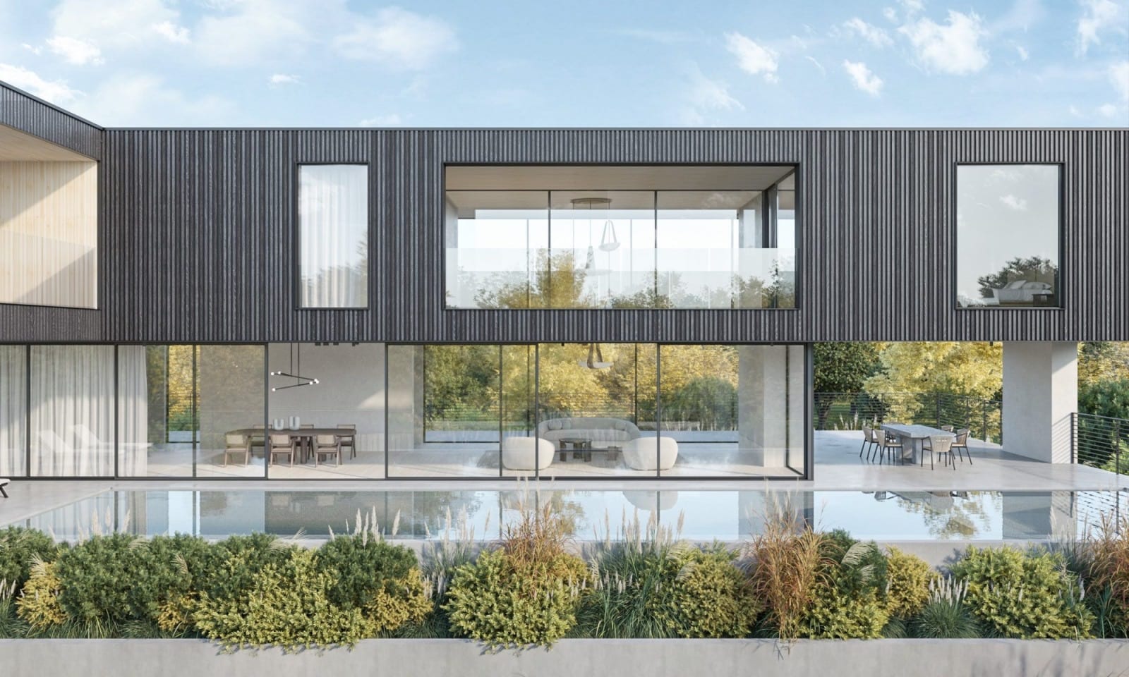 Facade of a contemporary two-storey home with large Slimline glass openings and a pool