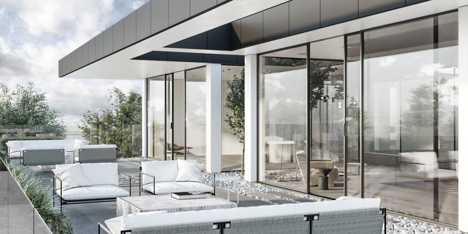 Outdoor terrace of a fully glazed modern home with the Slimline sliding system
