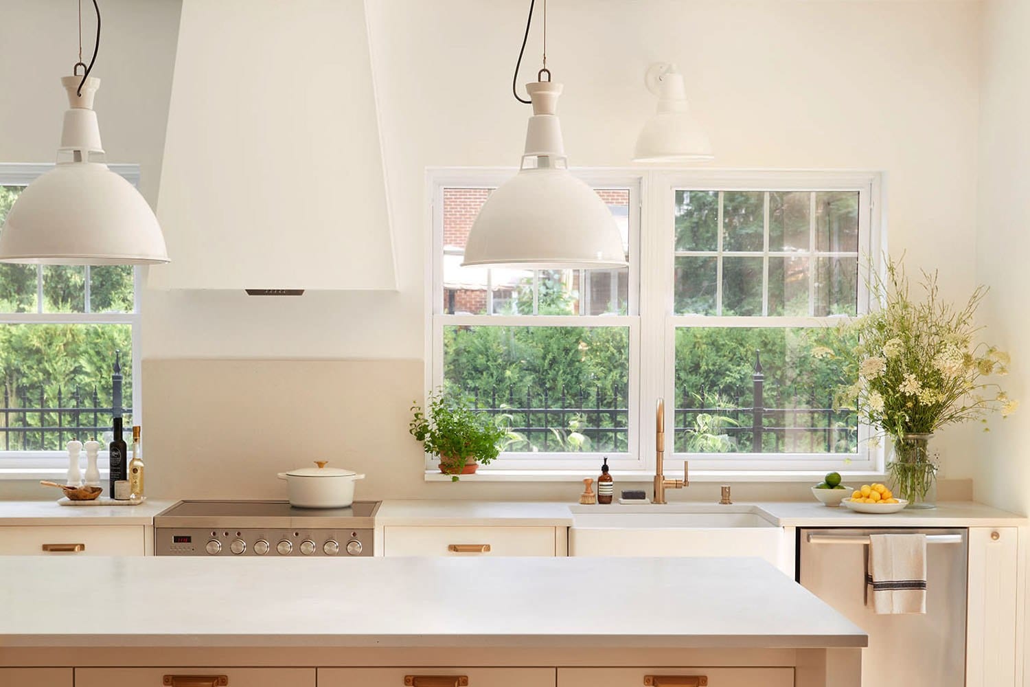 Two white Fenplast hung windows above the sink of a bright kitchen: six pane upper sash, horizontal meeting rail at mid height, clear lower sash
