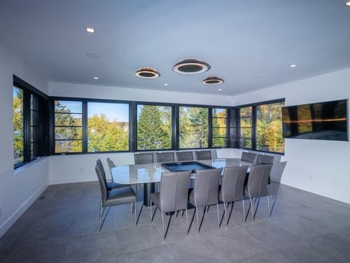 Black corner casement windows in a modern dining room