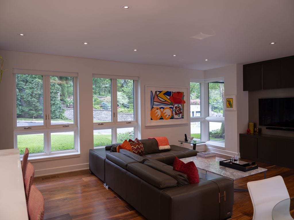 White casement windows in a bright living room