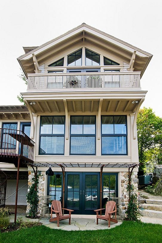 Facade of a two-storey home with double-hung windows and a balcony
