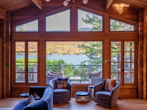 Gable wood fixed windows with a lake view