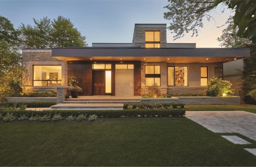 Contemporary home at dusk with fixed windows