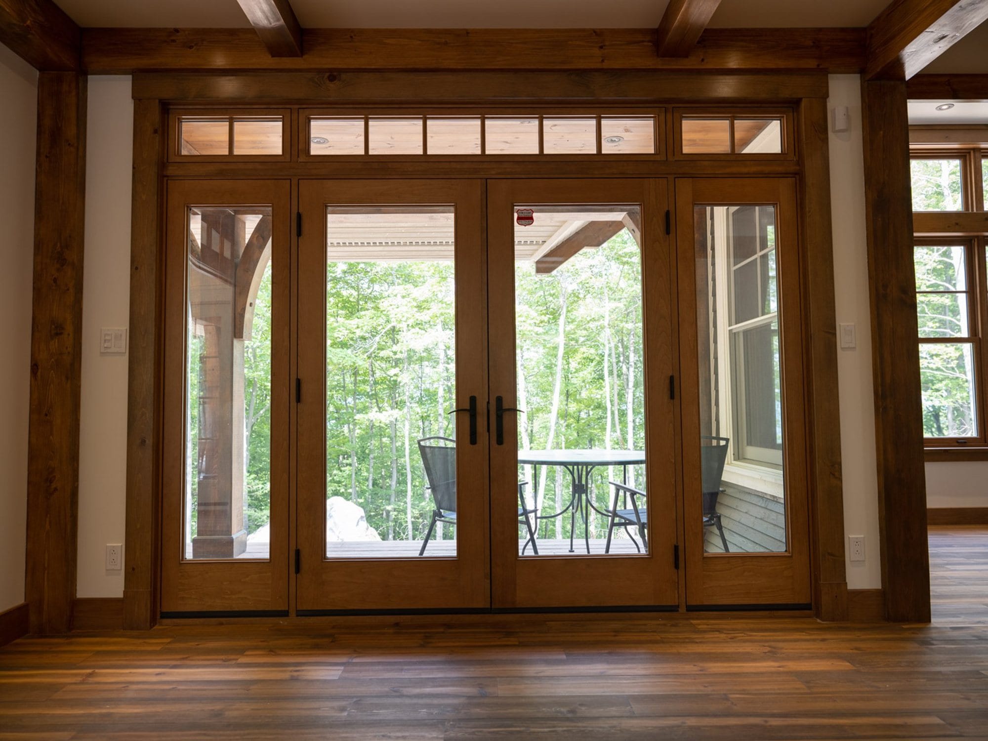 Solid wood french door with transom and sidelites, wood interior