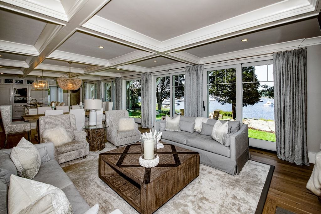 White lift-and-slide door in a large bright living room