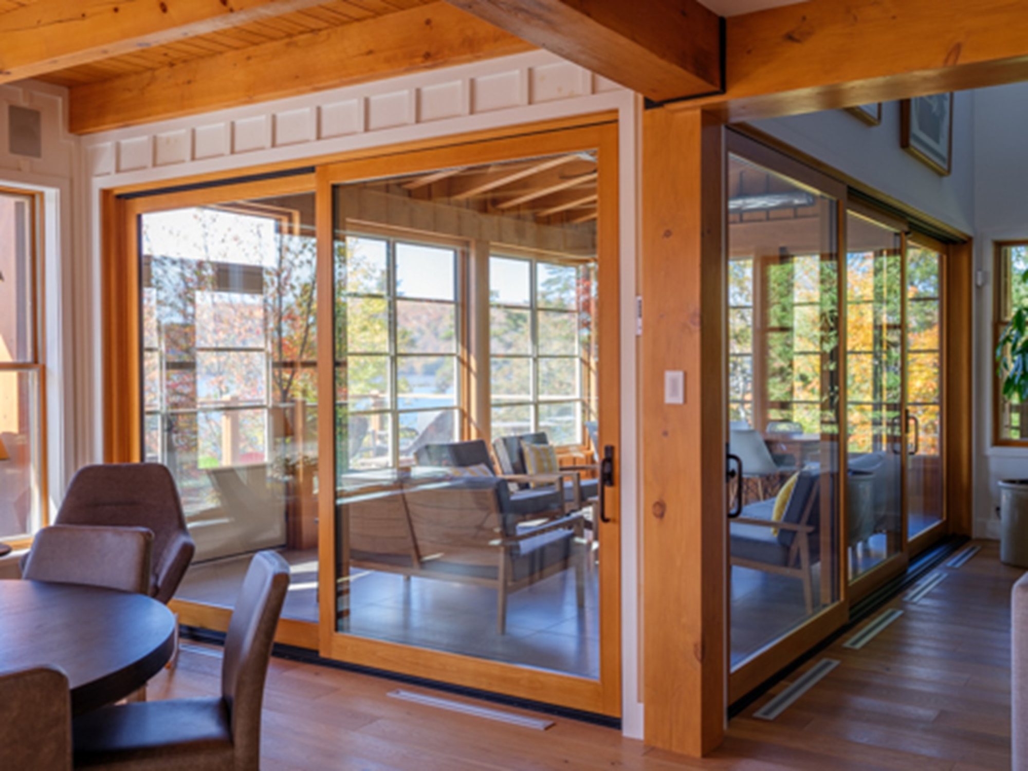 Lepage Millwork wood lift and slide door in a timber framed room